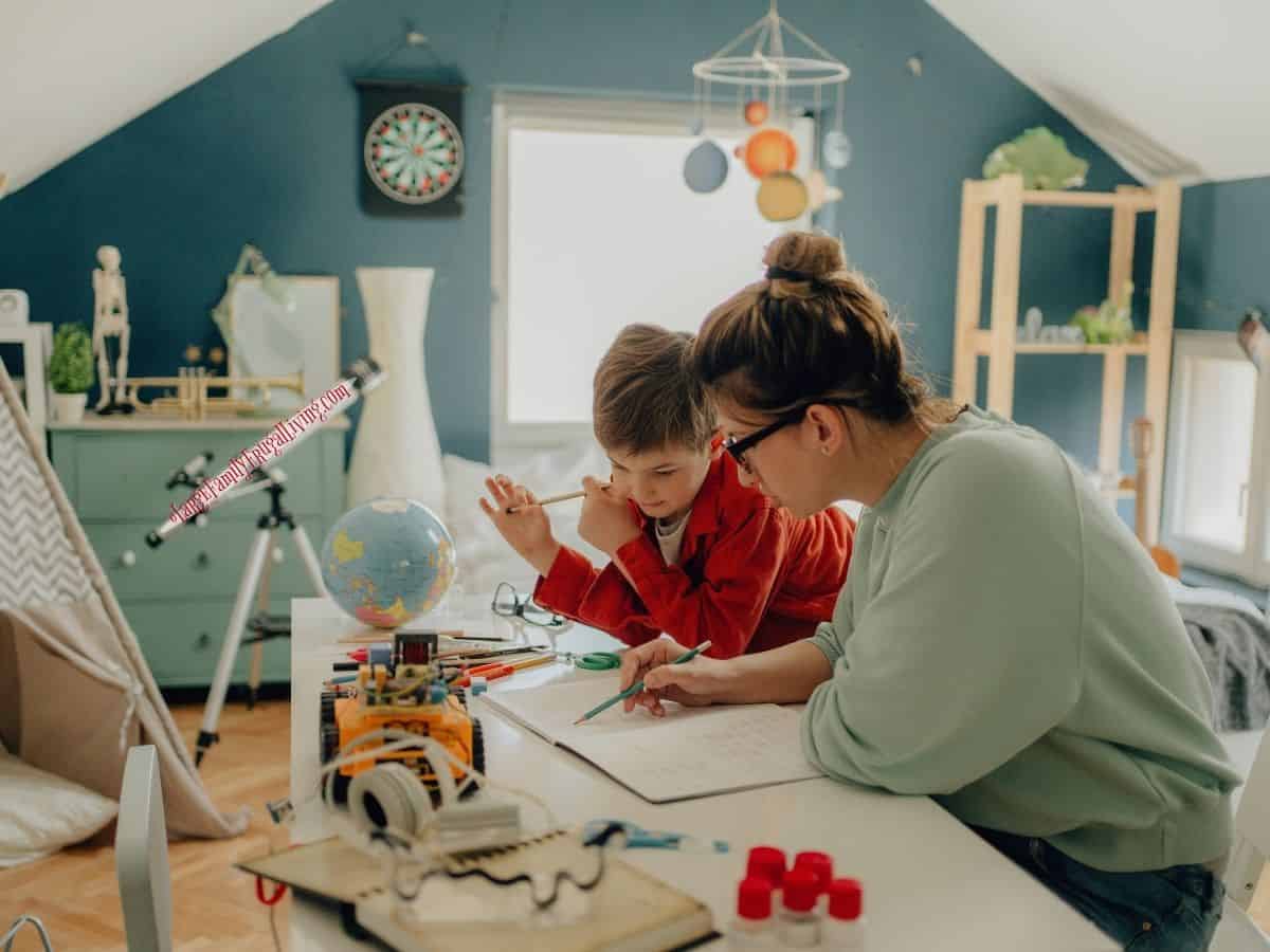 Boy being homeschooled with his mother in his room