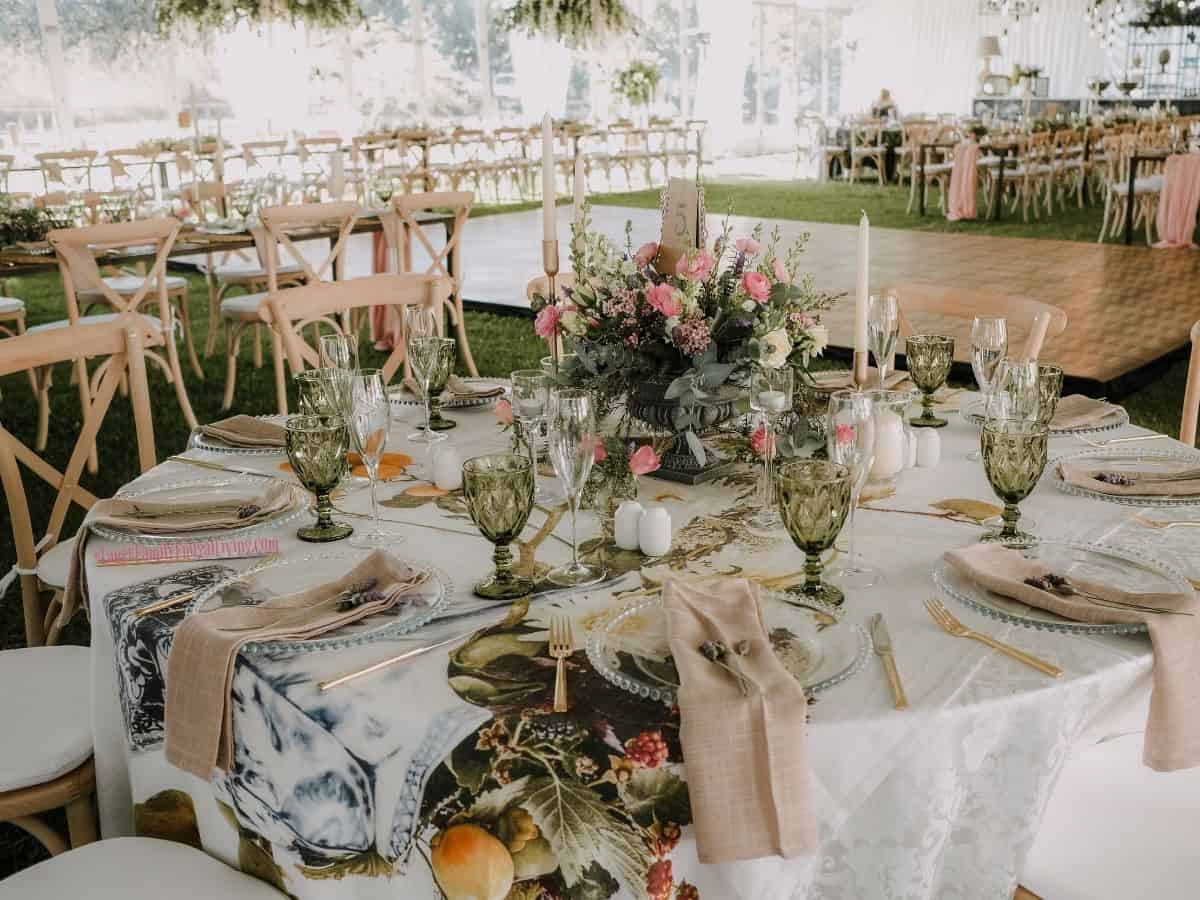 Formal wedding reception set up outdoors with wood dance floor