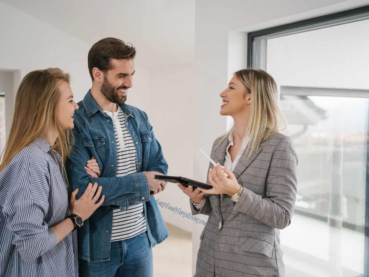 Female real estate agent showing her clients a newly built home