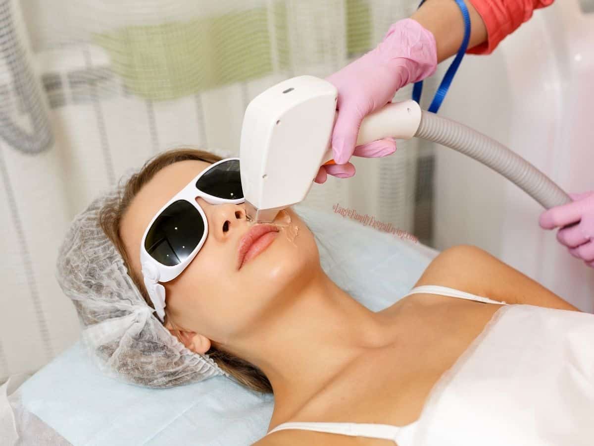 Woman wearing eye protection having laser hair removal procedure at a day spa.