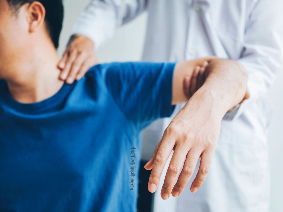 Doctor consulting with patient about shoulder pain; physical therapy diagnosis